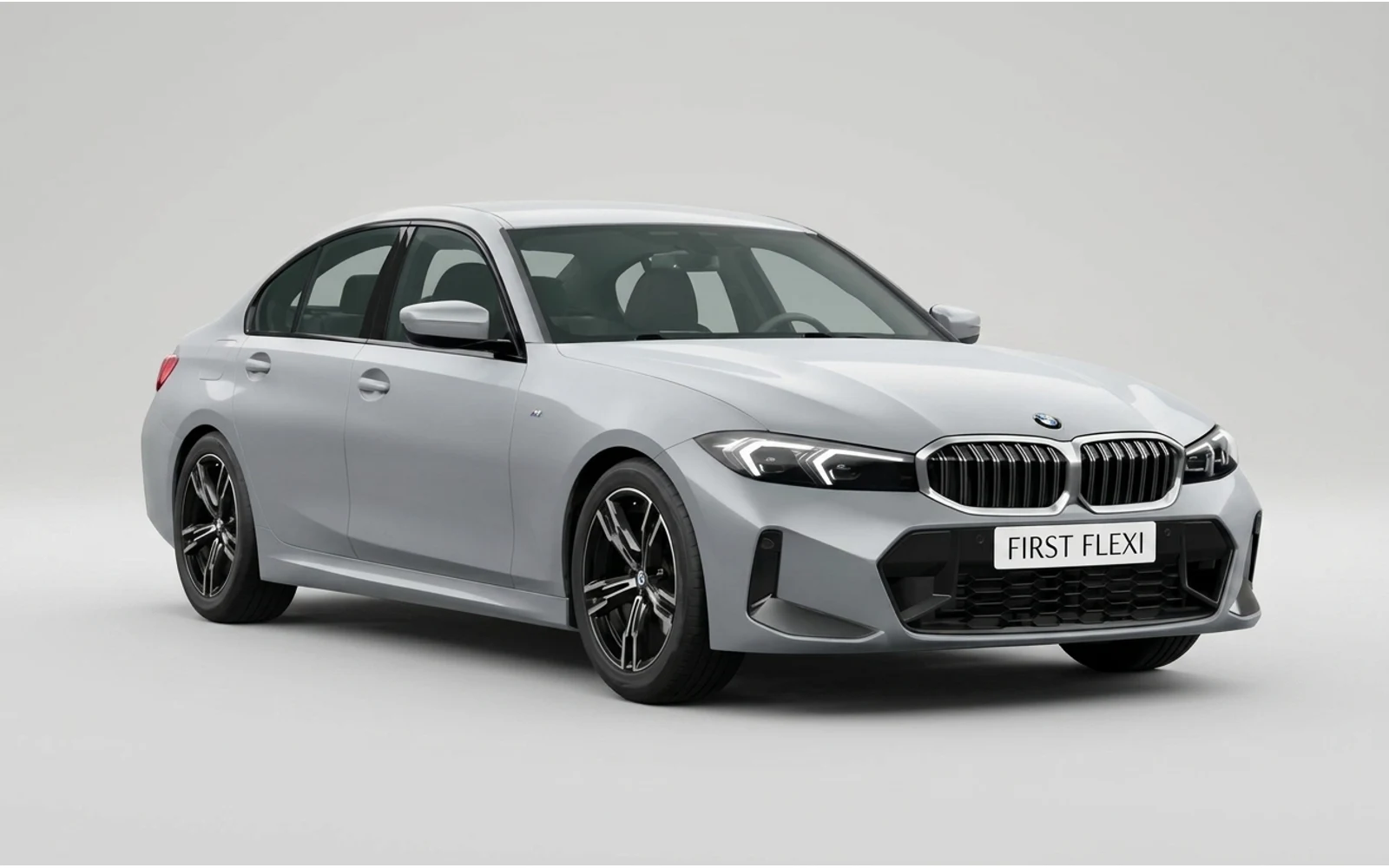 Front 3/4 view of a silver BMW 3 Series sedan with a white background.