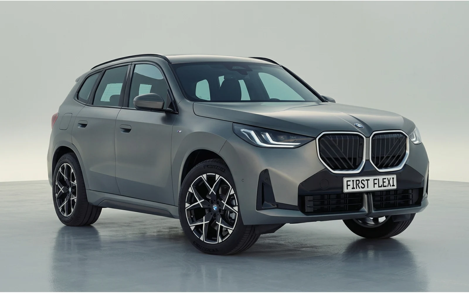 A front view of a dark grey BMW X3.