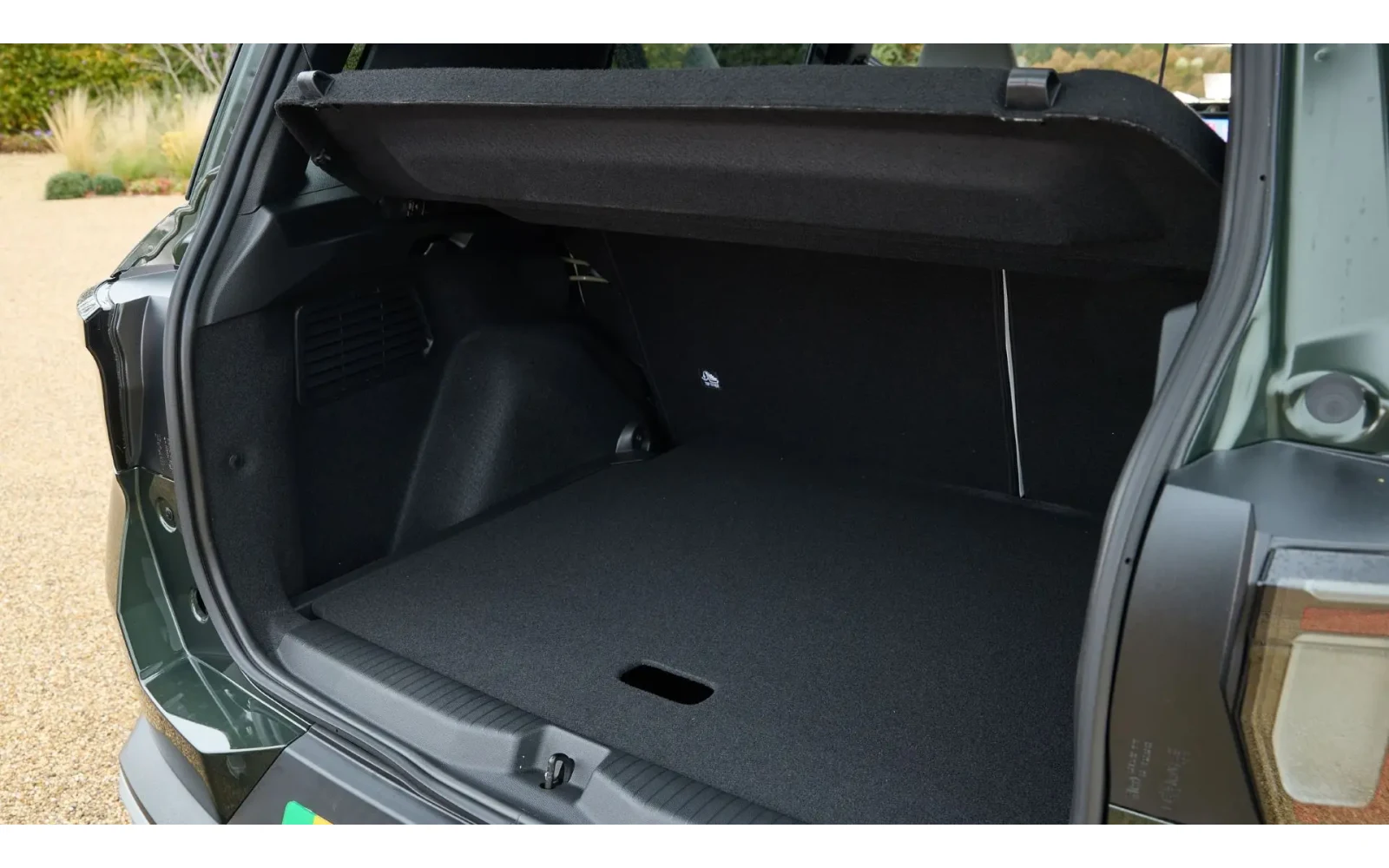Rear view of a dark green Citroen C3 Aircross boot space.