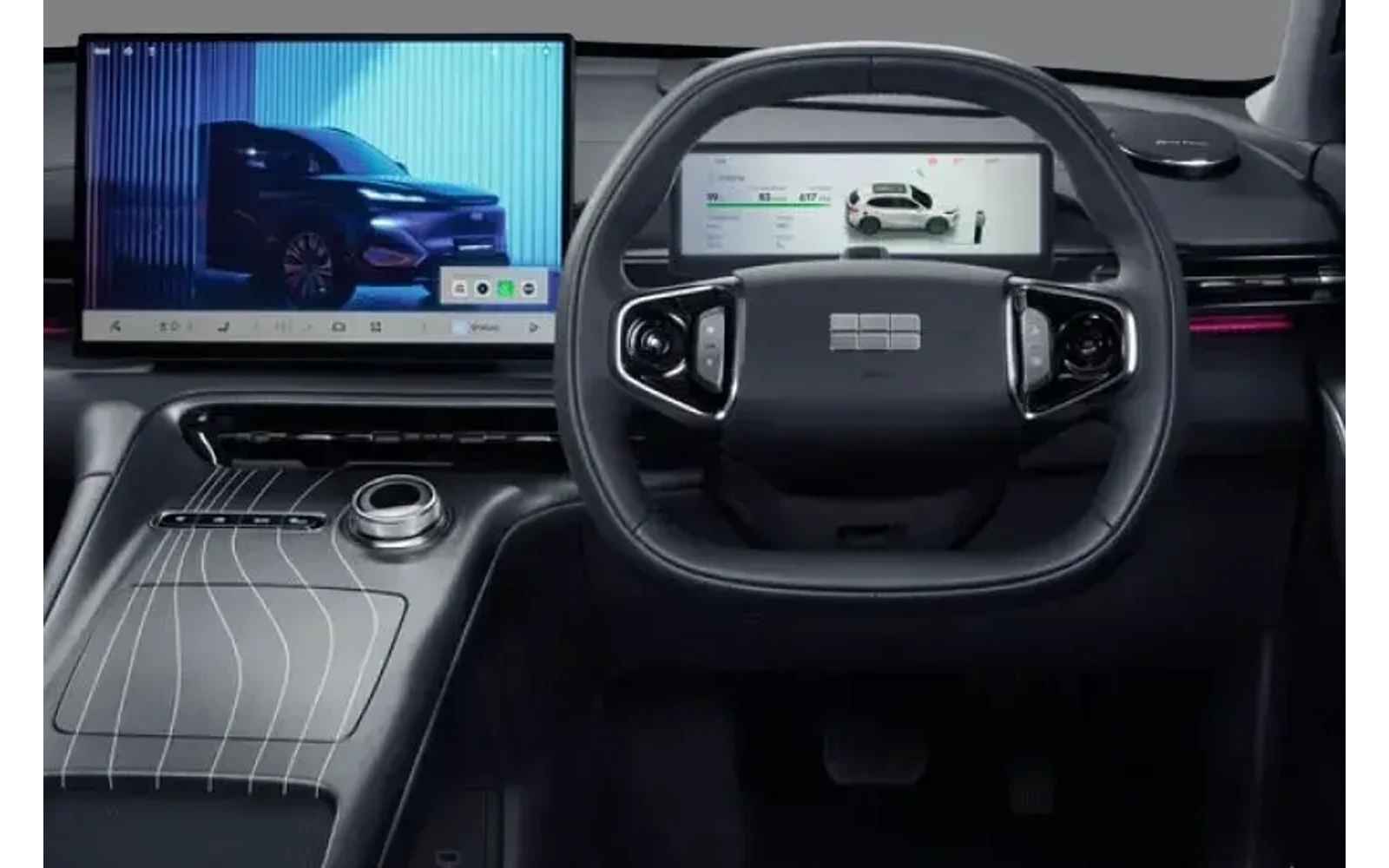 Interior view of a dark-colored Geely Starray with large screens.