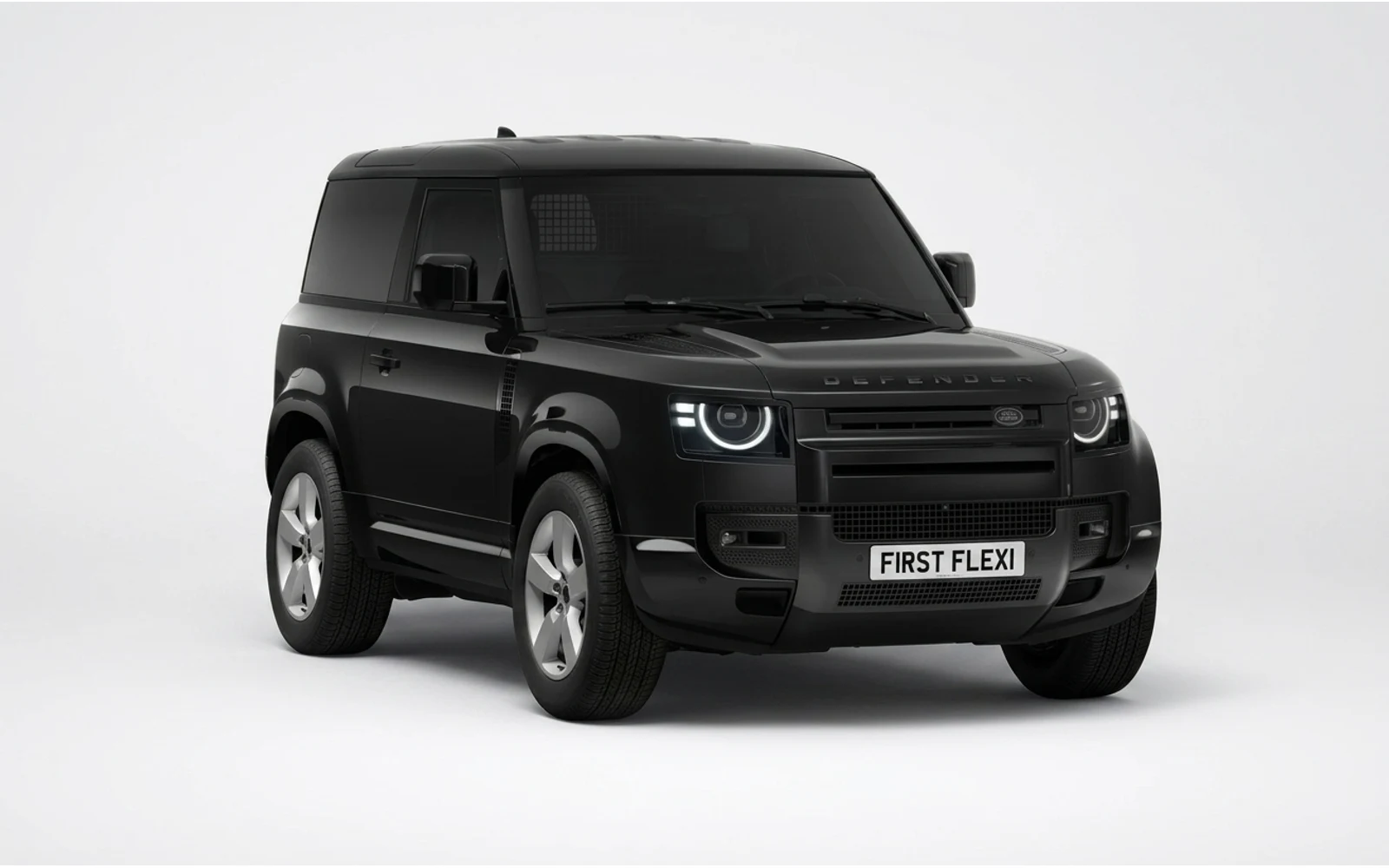 Front three-quarter view of a black Land Rover Defender 90.