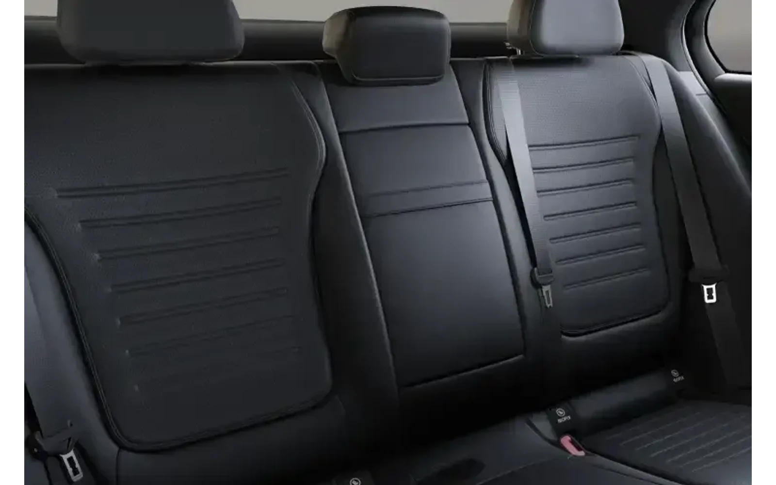 Black leather Mercedes-Benz C Class rear seats seen from an eye-level viewpoint.