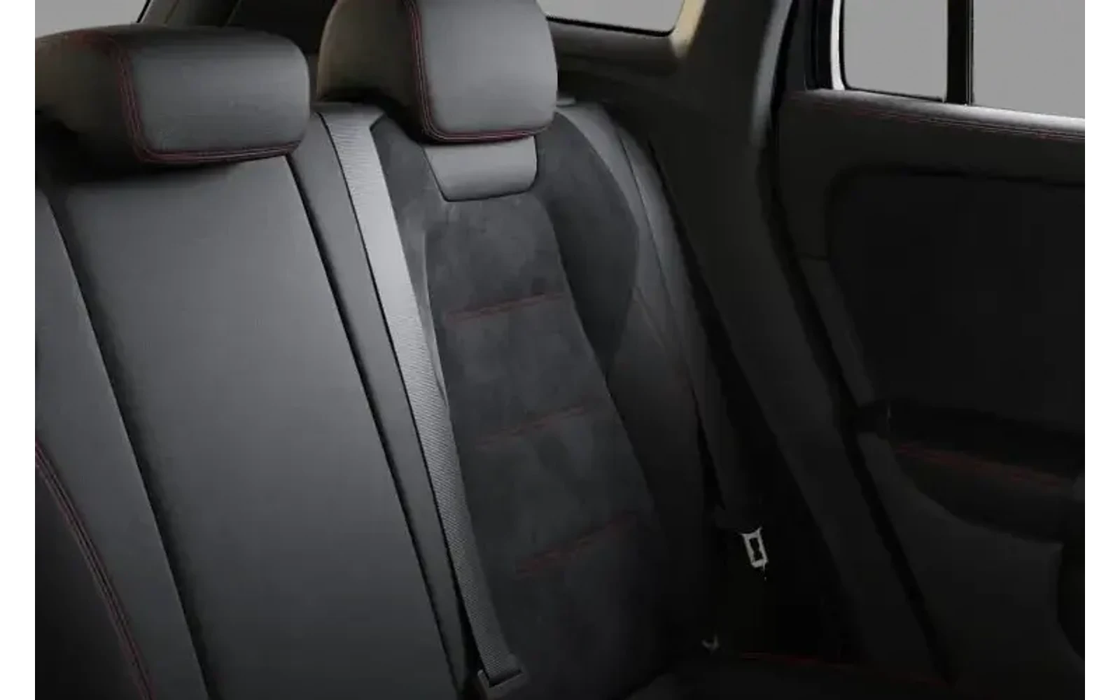 Close-up view of the black interior of a Mercedes-Benz GLA with red stitching.