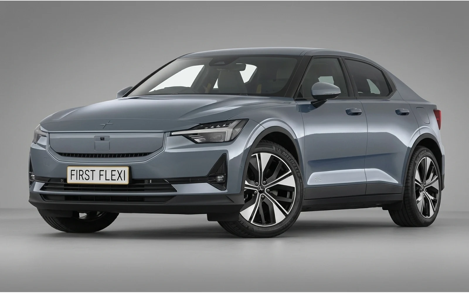 A silver Polestar 2 in a three-quarter front view against a black background.