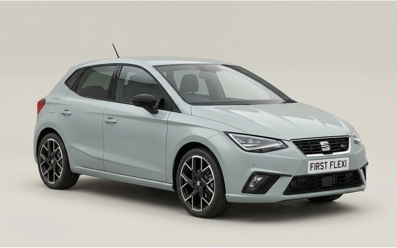 Light grey Seat Ibiza seen from a rear three-quarter view.