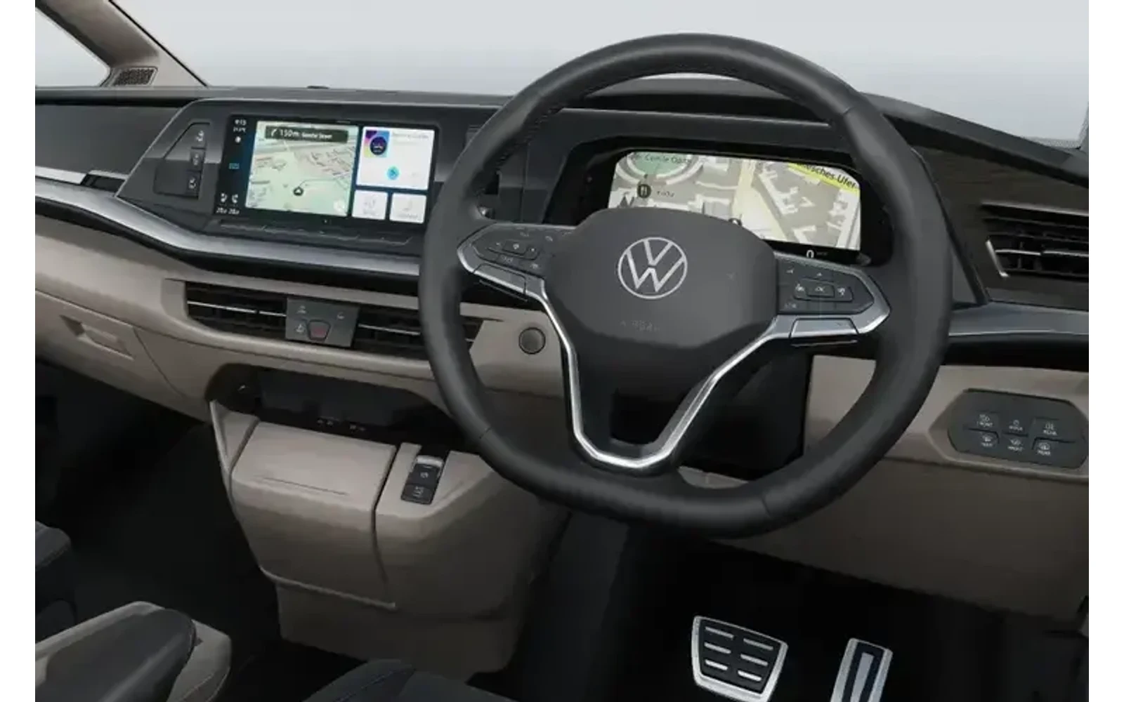 Interior of a beige and black Volkswagen Multivan showing the dashboard and steering wheel.