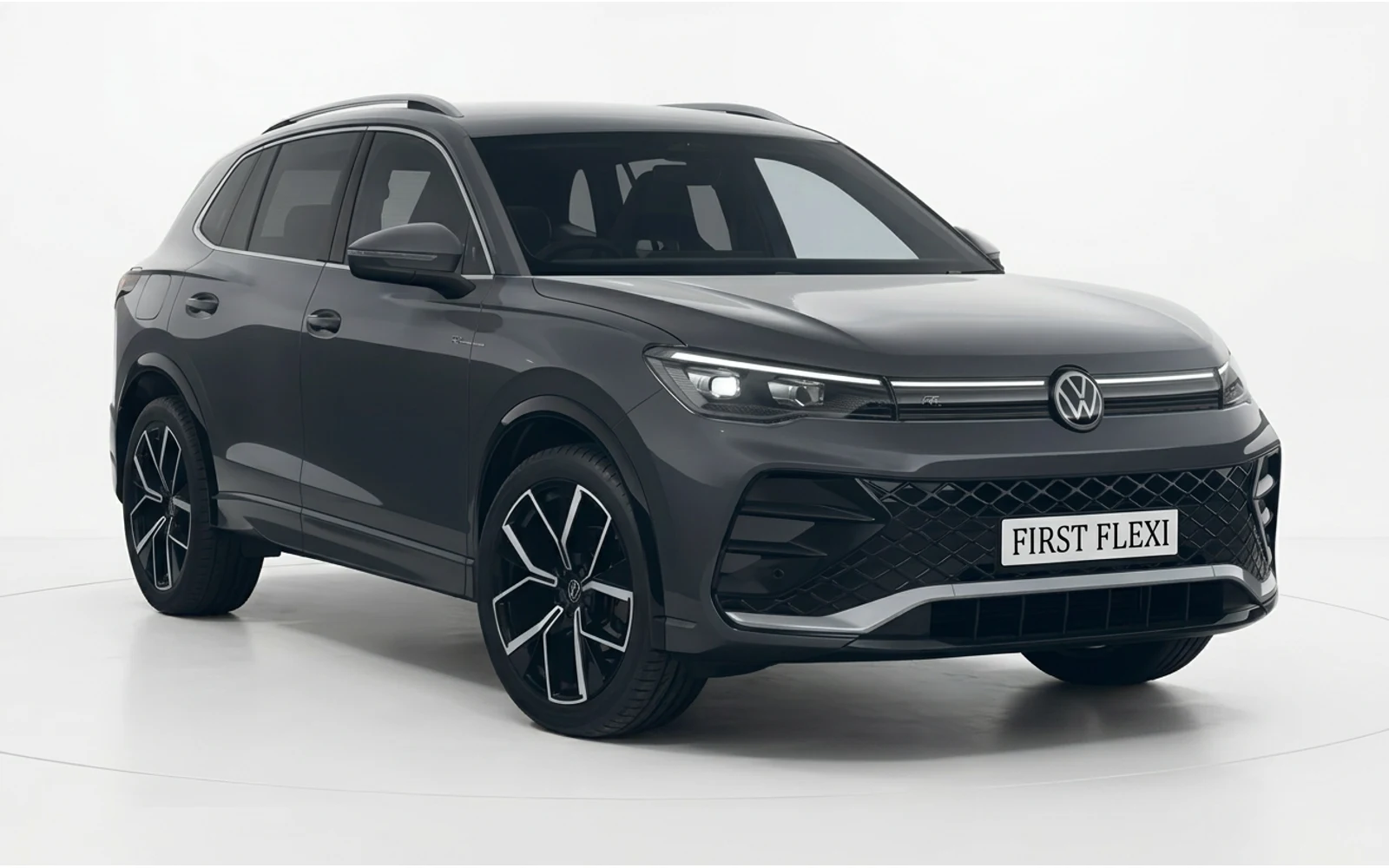 Dark grey Volkswagen Tiguan SUV seen from a three-quarter front angle.
