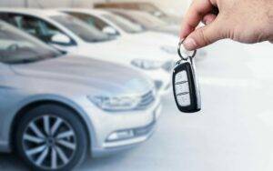 man holding new lease car keys