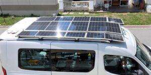 Electric van with solar panels on roof.