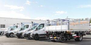 Drop-side vans parked neatly, ready for work.