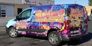 Van with professional branding graphics.